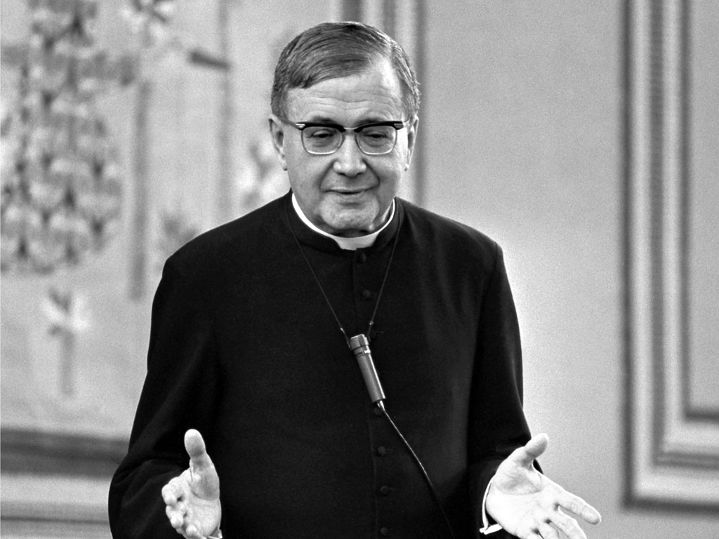 St. Josemaria Escriva speaking with hands outstretched